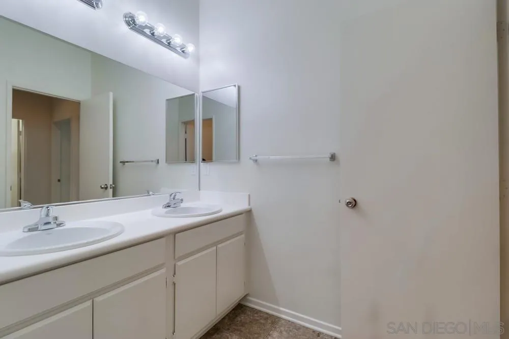1257 Idanan Road, Unit 3 Chula Vista, CA 91913 - Photo 29 of 40 a bathroom with a sink and a mirror