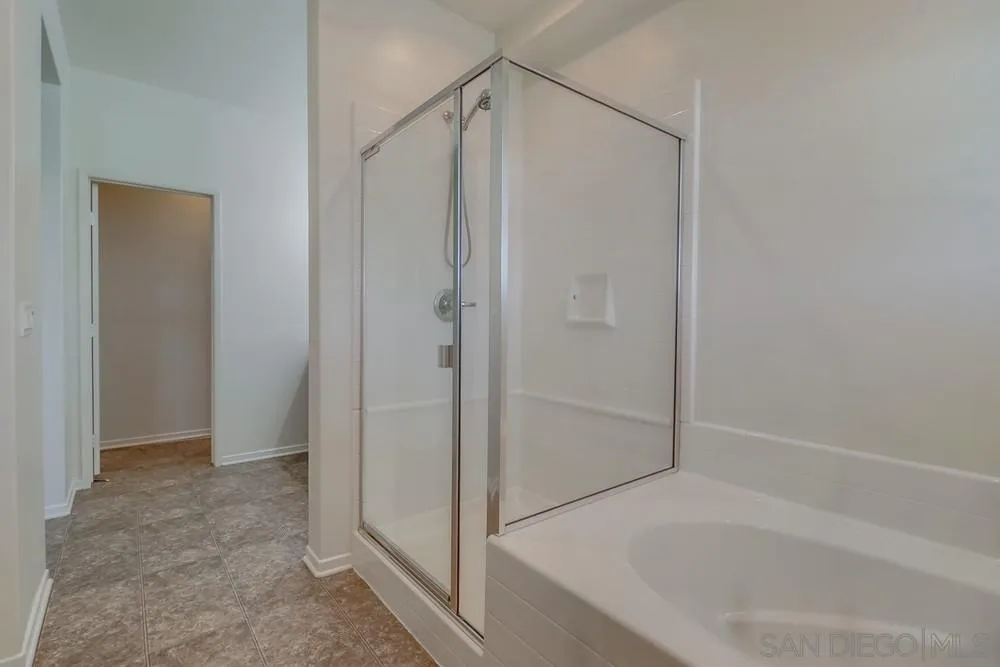 1257 Idanan Road, Unit 3 Chula Vista, CA 91913 - Photo 37 of 40 a bathroom with a shower and a bath tub