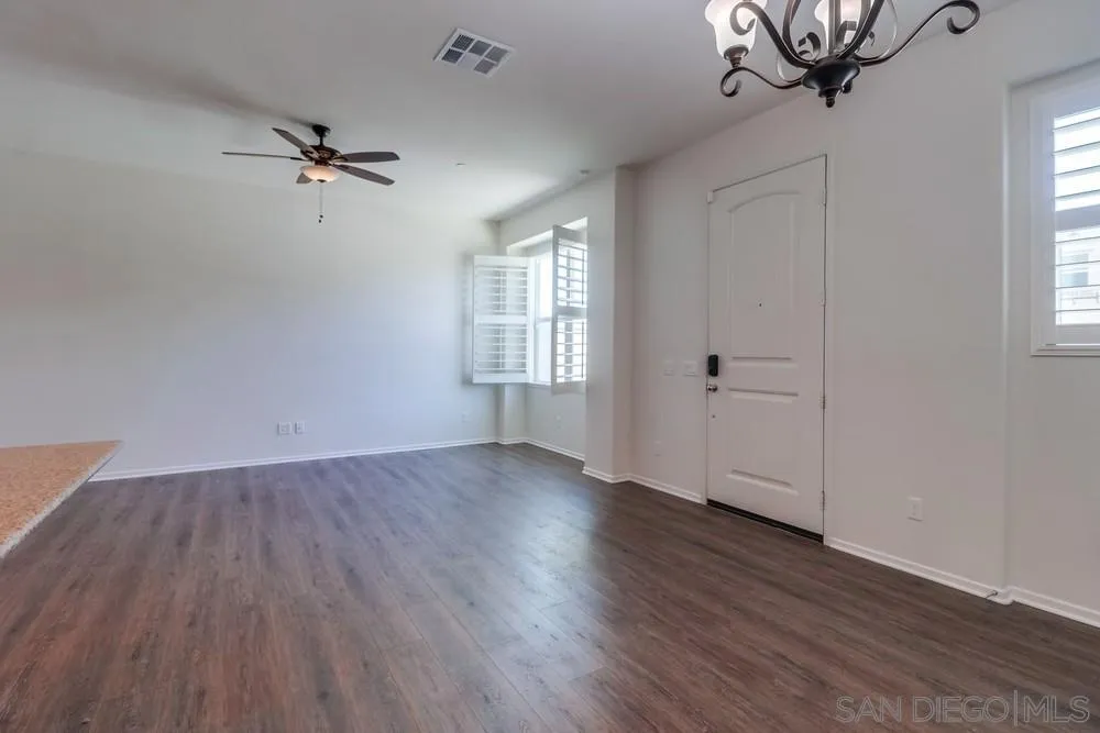 1257 Idanan Road, Unit 3 Chula Vista, CA 91913 - Photo 8 of 40 wooden floor in an empty room with a window