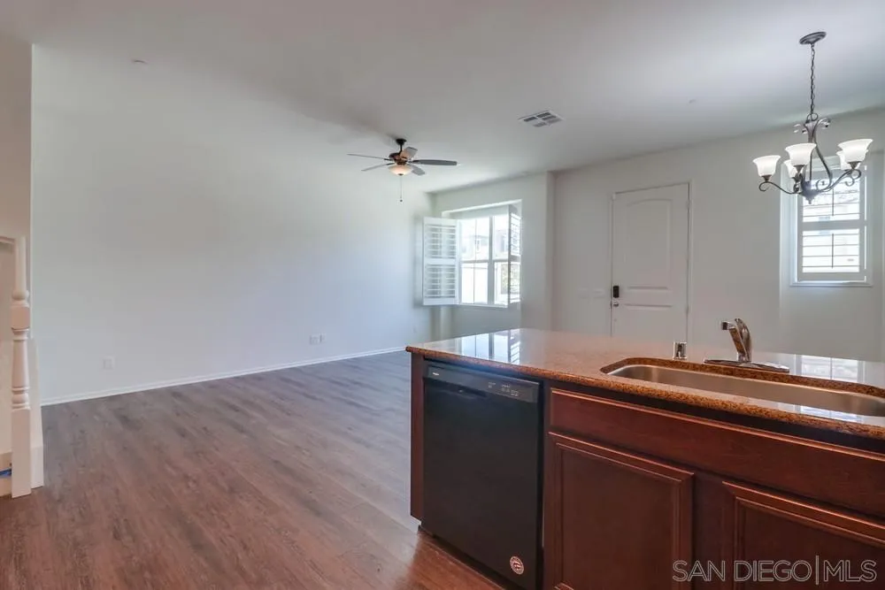 1257 Idanan Road, Unit 3 Chula Vista, CA 91913 - Photo 10 of 40 a room with a sink and chandelier