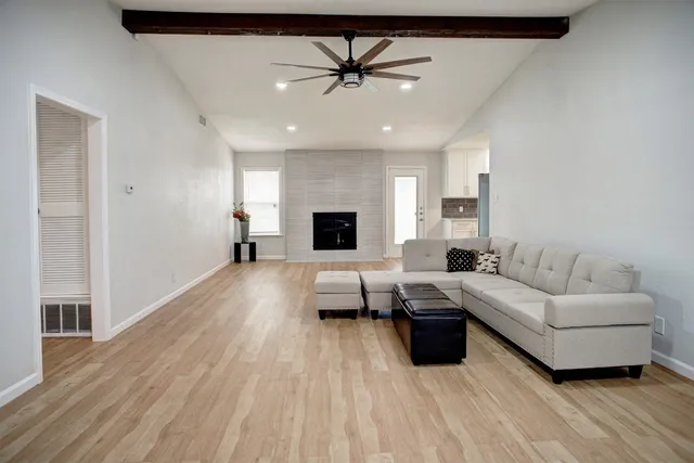 a living room with furniture and a fireplace