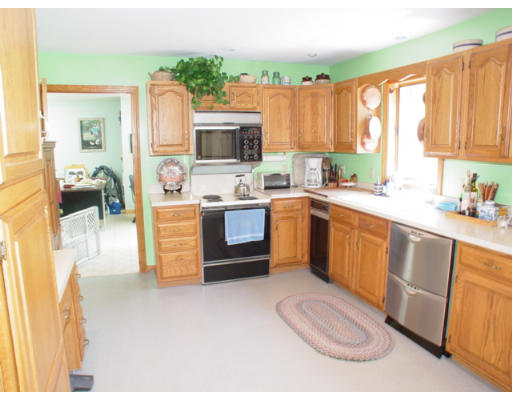29 Blacksnake Road Salisbury, MA 01952 - Photo 3 of 7 a kitchen with a sink stove and cabinets