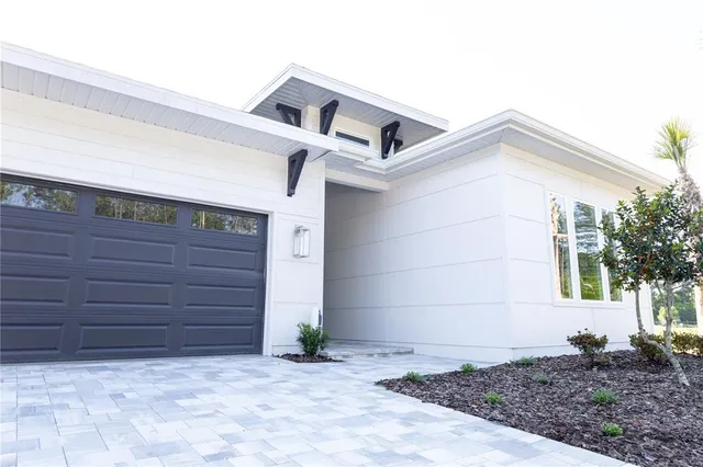 a view of a house with a garage