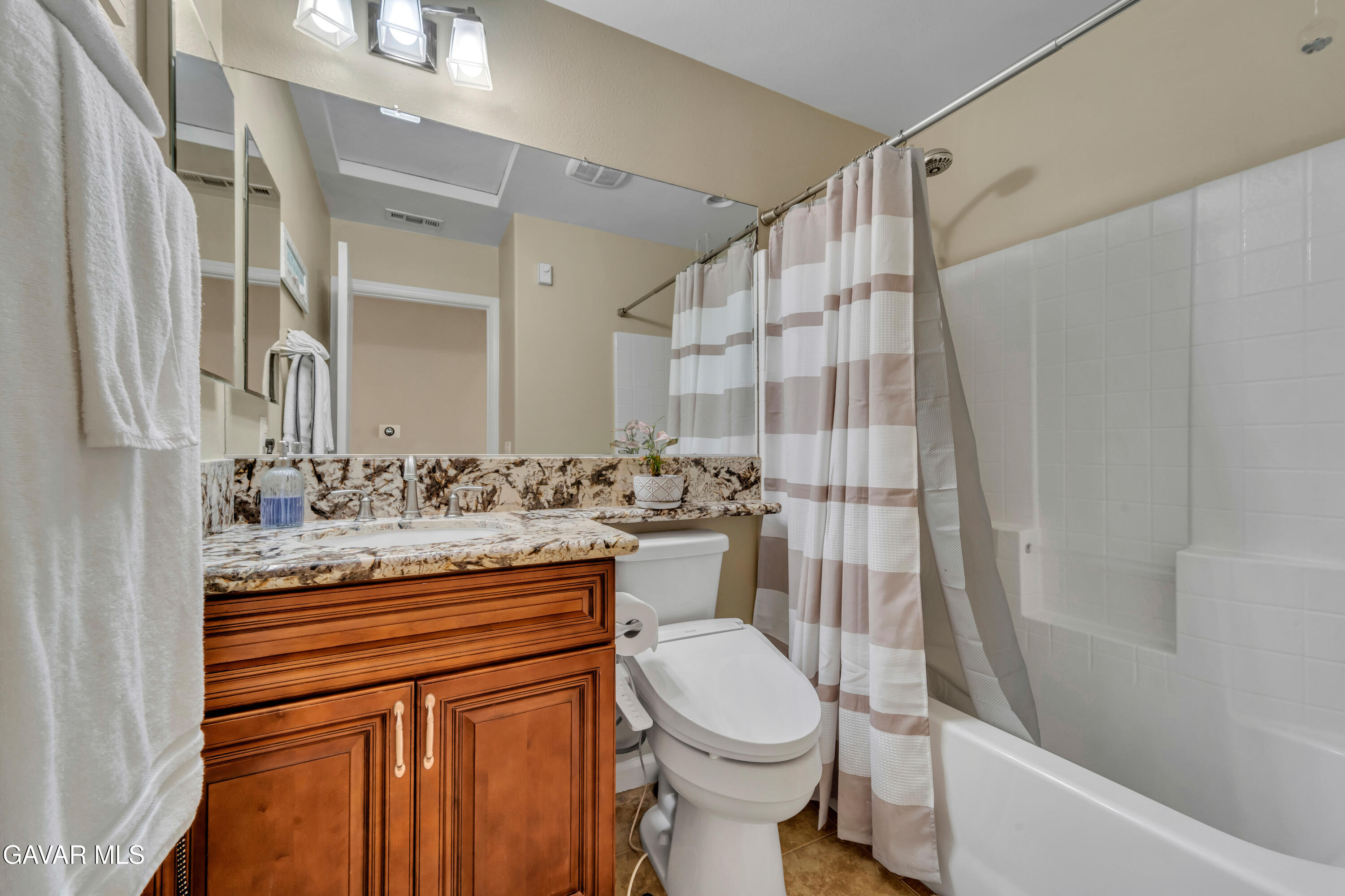1415 Richfield Avenue Rosamond, CA 93560 - Photo 15 of 21 a bathroom with a sink toilet and shower