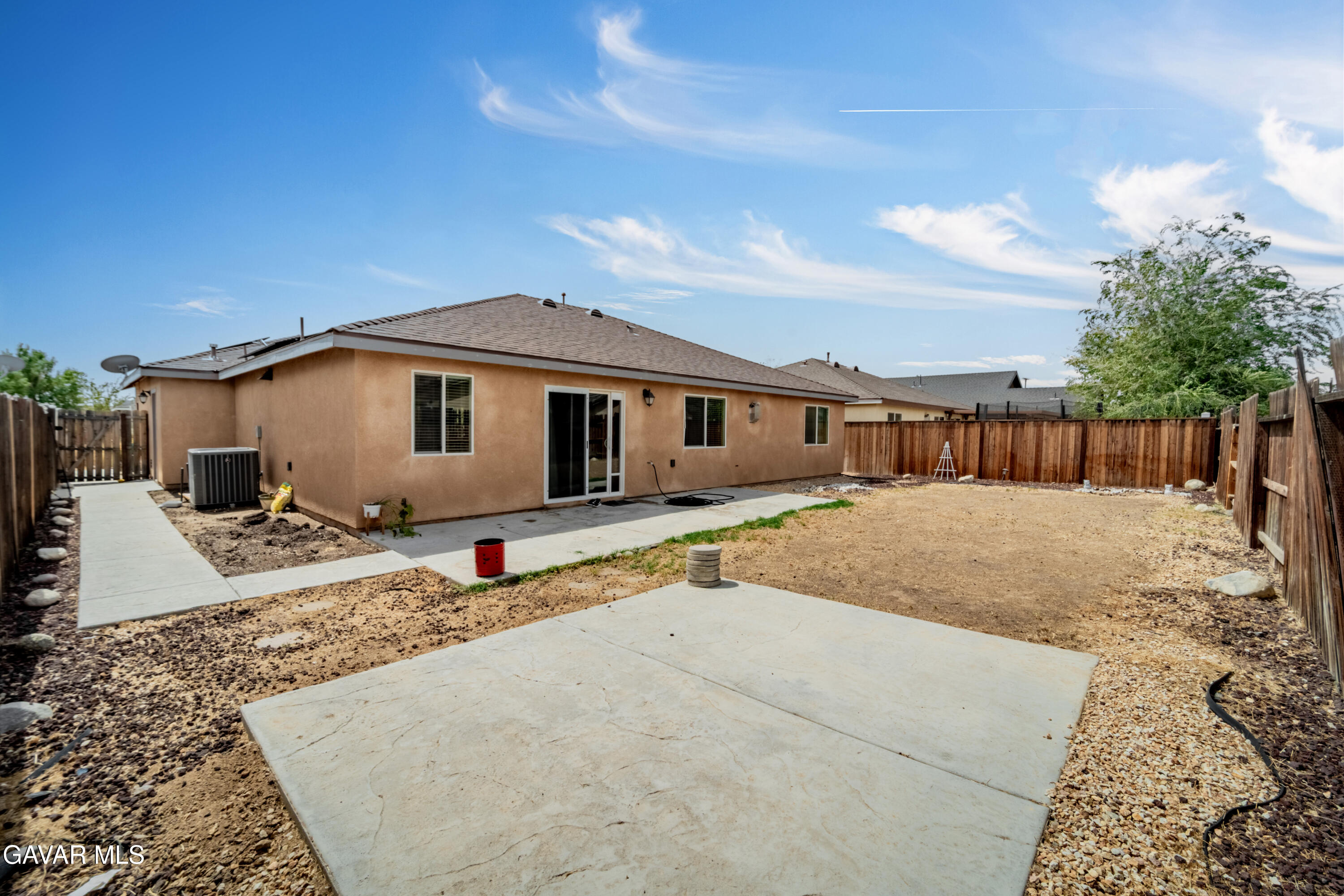 1415 Richfield Avenue Rosamond, CA 93560 - Photo 18 of 21 a front view of a house with a yard