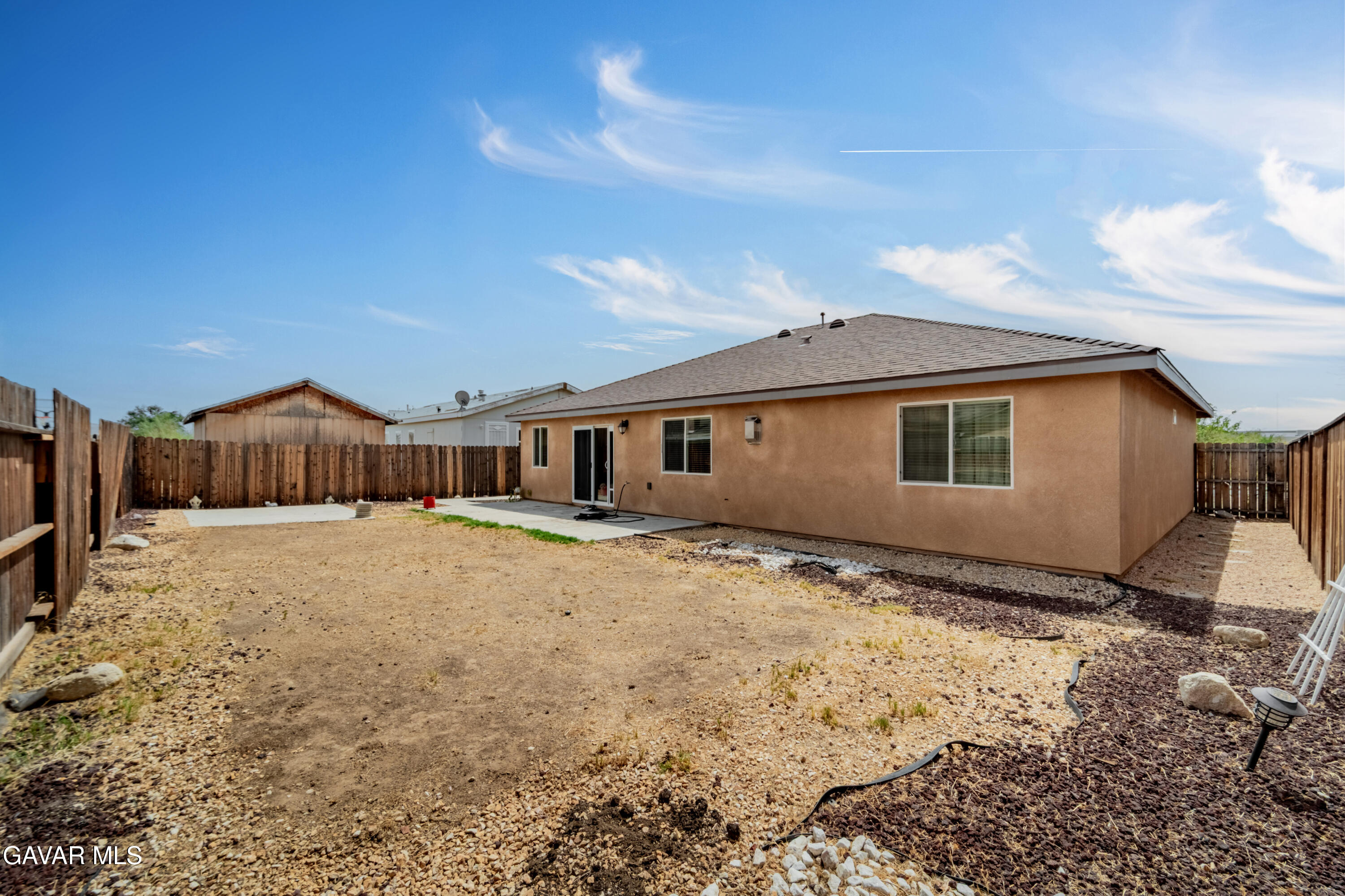 1415 Richfield Avenue Rosamond, CA 93560 - Photo 19 of 21 a front view of a house with a yard