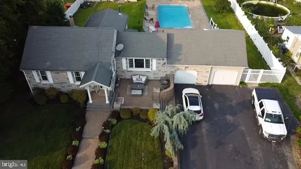 an aerial view of a house with outdoor space and street view
