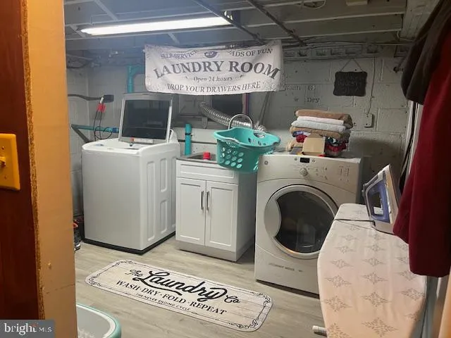 a kitchen with stainless steel appliances granite countertop a sink a stove and refrigerator