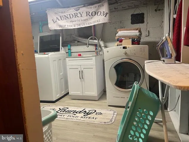 a kitchen with sink dining table and chairs