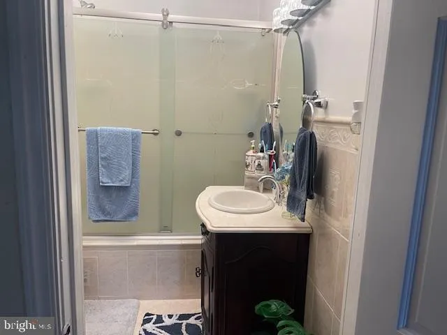a view of a chair and table on the wooden deck