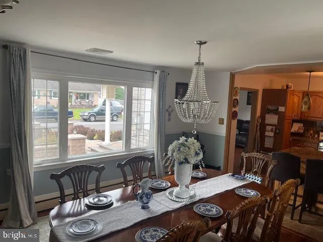 a view of backyard with swimming pool and outdoor seating