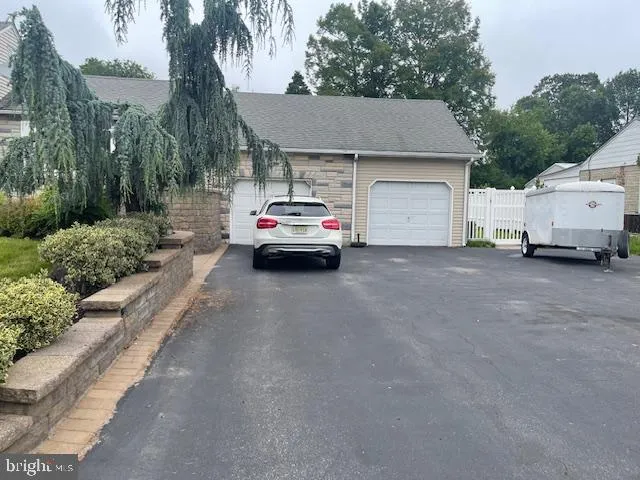 a view of a car in front of house