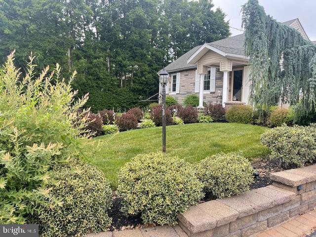 51 Washington Avenue Carneys Point, NJ 08069 - Photo 6 of 63 a front view of a house with a yard and green space