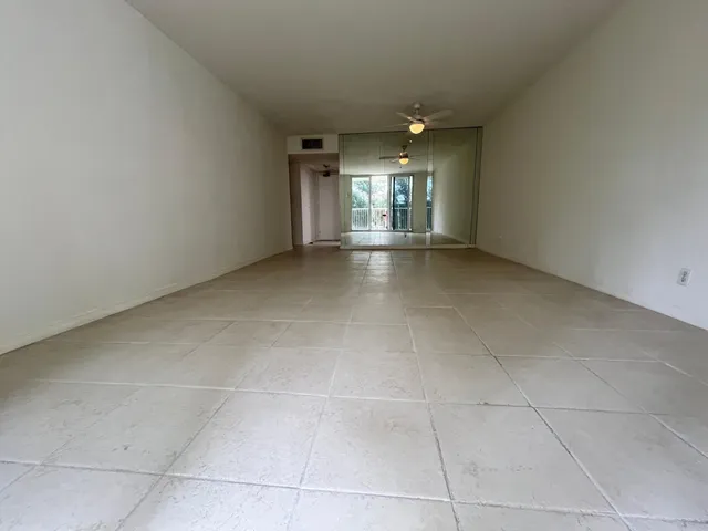 a room with furniture pool table and window