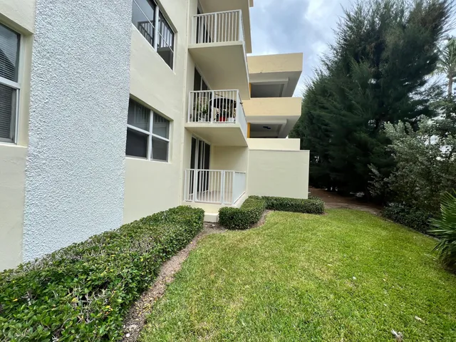 a aerial view of a house with a yard and garage