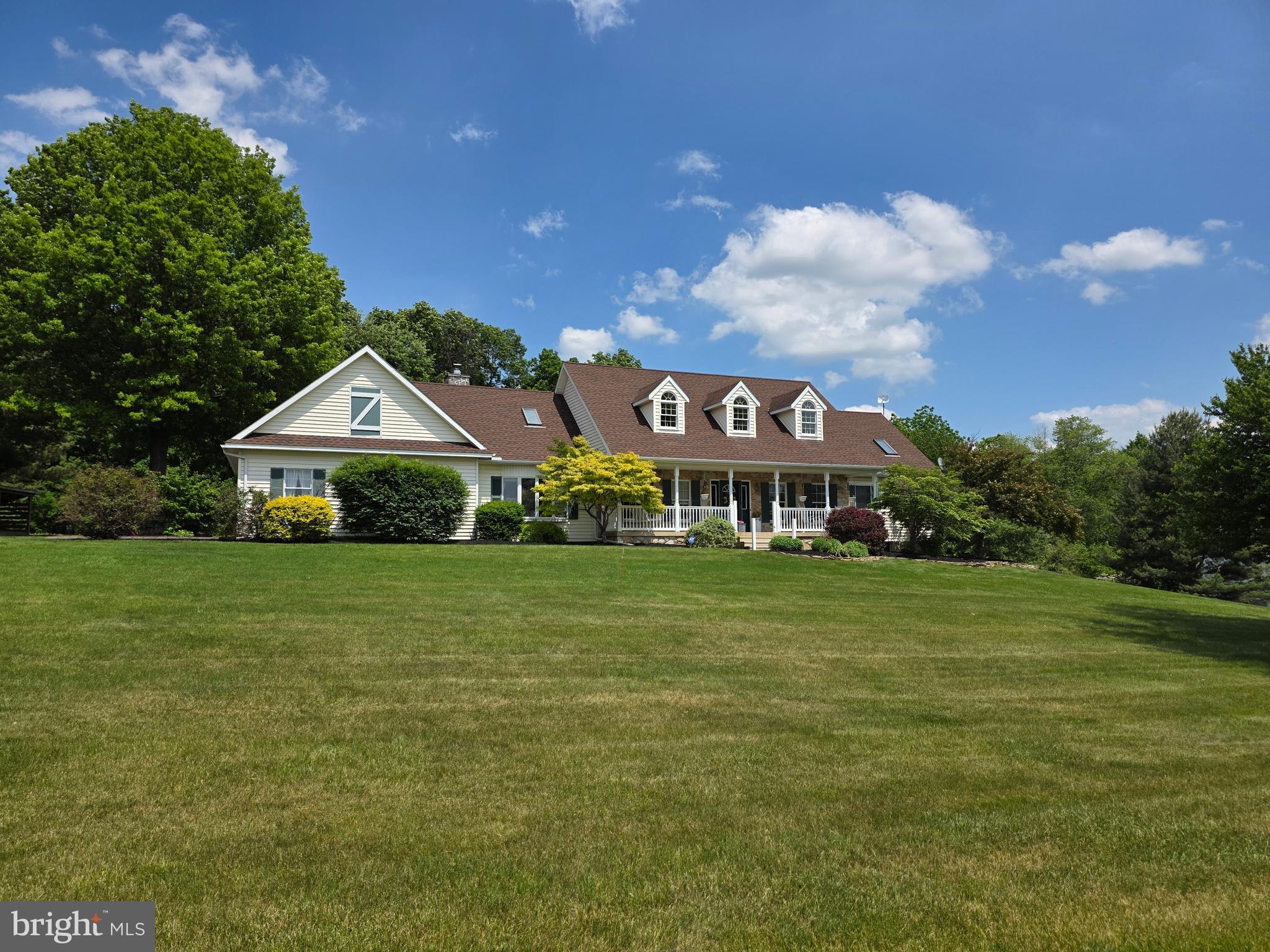 509 Buchland Road Narvon, PA 17555 - Photo 10 of 94 a view of a house next to a big yard with large trees