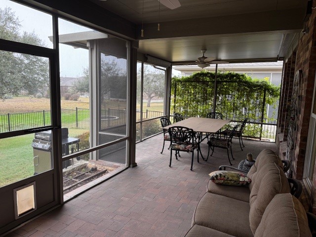 106 Calhoun Lane Georgetown, TX 78633 - Photo 15 of 16 Sunroom with a ceiling fan and outdoor dining area