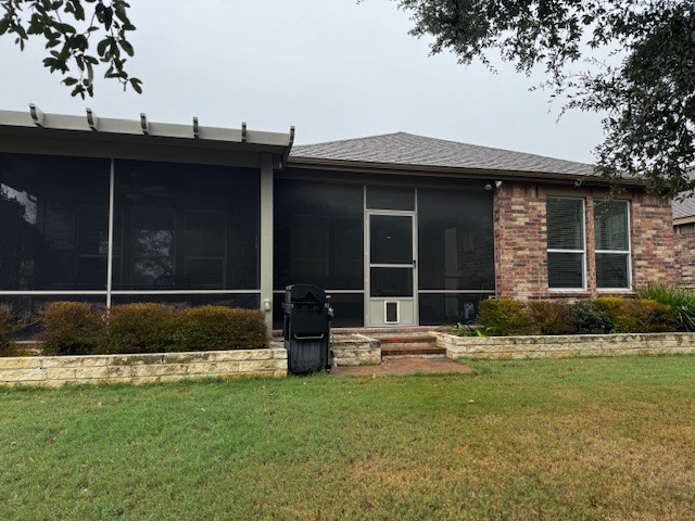 106 Calhoun Lane Georgetown, TX 78633 - Photo 16 of 16 Rear view of property featuring a sunroom,