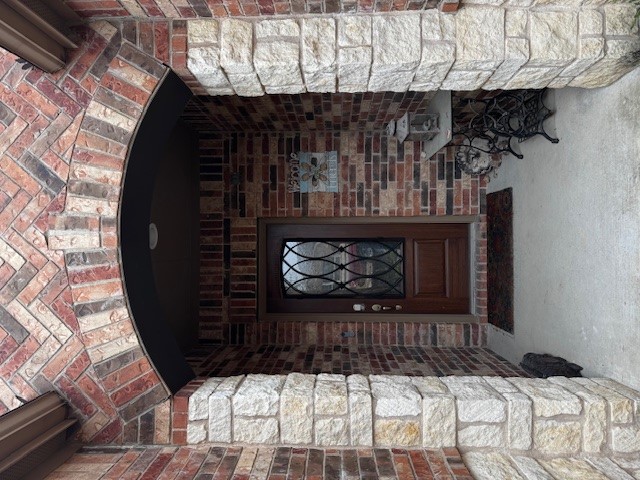 106 Calhoun Lane Georgetown, TX 78633 - Photo 2 of 16 View of exterior entry featuring brick siding