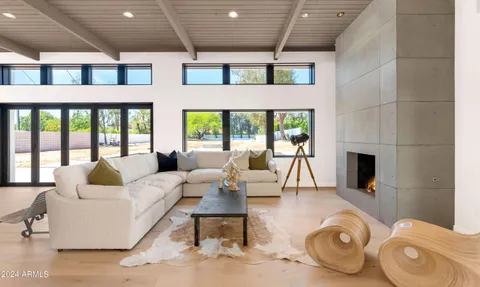 a living room with furniture and a table