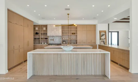 a view of kitchen with furniture and flat screen tv