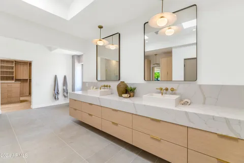 a bathroom with a sink and shower