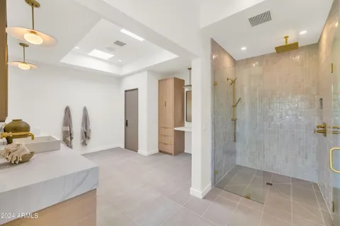 a bathroom with a bathtub and window
