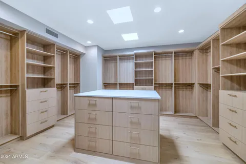 a bathroom with a sink vanity granite and a mirror