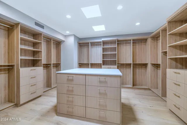 a bathroom with a sink vanity granite and a mirror
