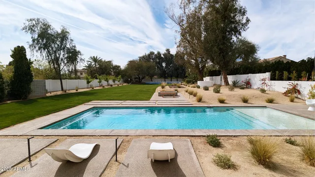 a view of yard with patio and a garden