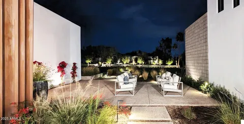 a view of a room with a ceiling fan and window