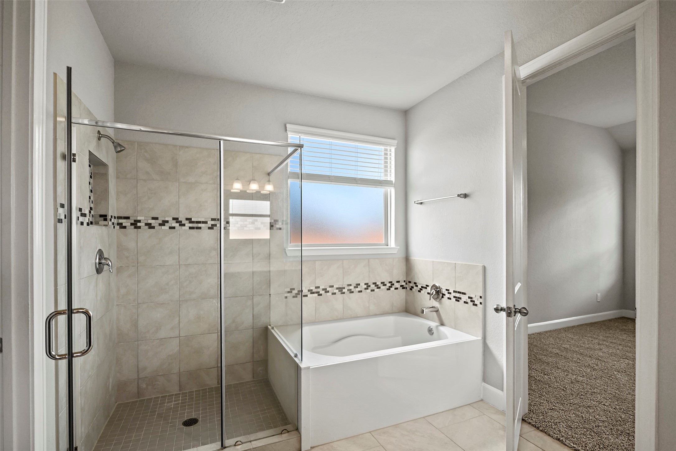 5839 Metaphor Way Rosenberg, TX 77469 - Photo 9 of 50 Primary bath shower and tub for those relaxing evenings.