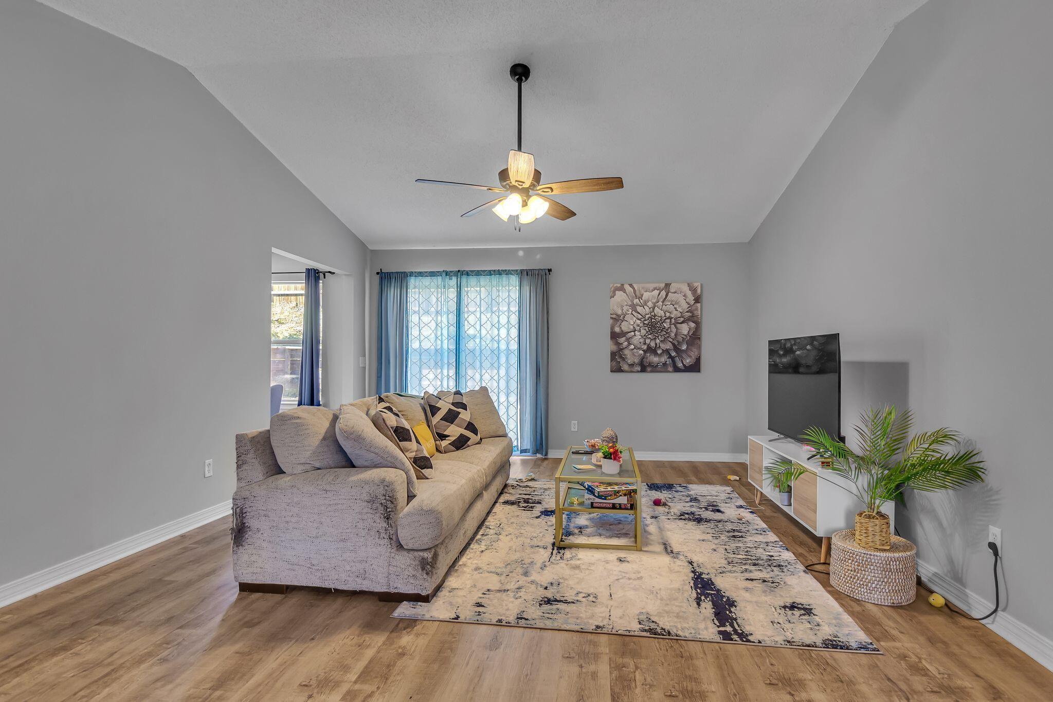 205 Trish Drive Crestview, FL 32536 - Photo 4 of 32 a living room with furniture and a chandelier