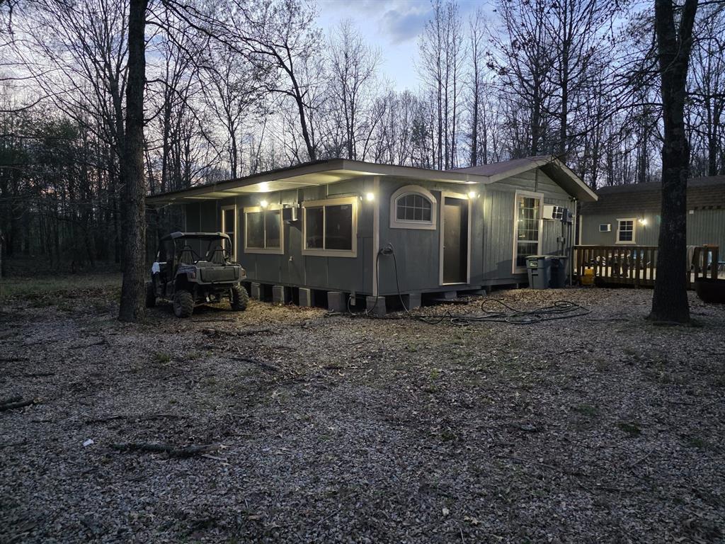 160 Zigler Road Avery, TX 75554 - Photo 2 of 14 View of front of house featuring a deck