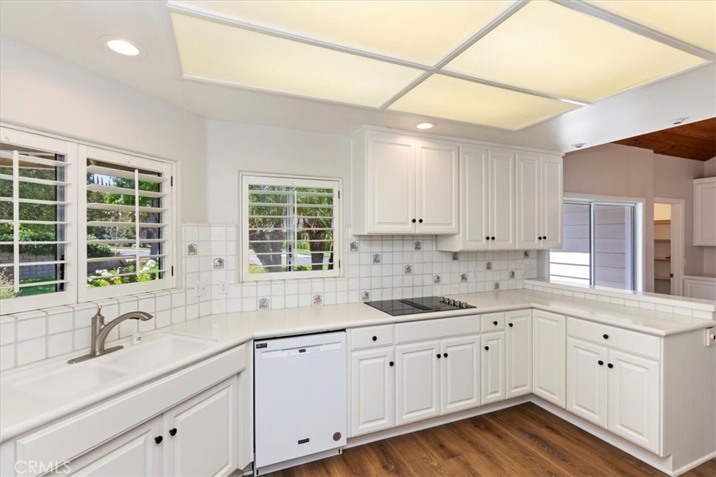 1507 Weston Way Riverside, CA 92506 - Photo 18 of 55 a kitchen with sink cabinets and window