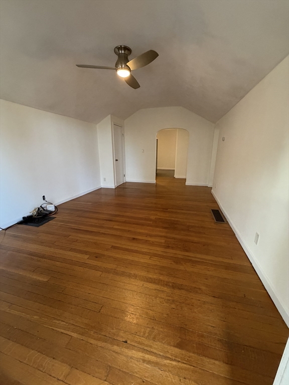 42 Fairview Street, Unit 42 Boston, MA 02131 - Photo 3 of 18 a bedroom with a bed and a chandelier