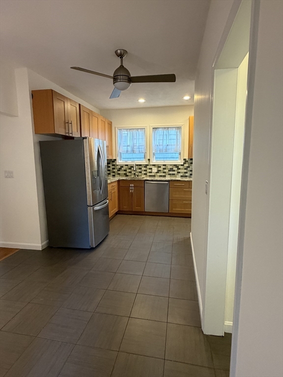42 Fairview Street, Unit 42 Boston, MA 02131 - Photo 7 of 18 a kitchen with stainless steel appliances granite countertop a refrigerator and a sink