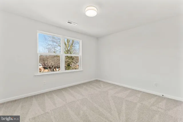 a view of a yard with an empty space