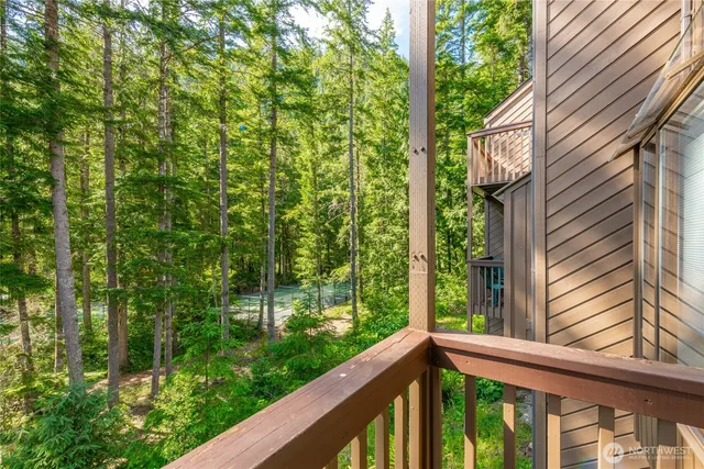 a view of a wooden fence next to a yard