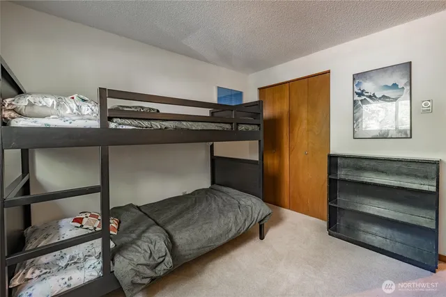 a bedroom with a bed and furniture