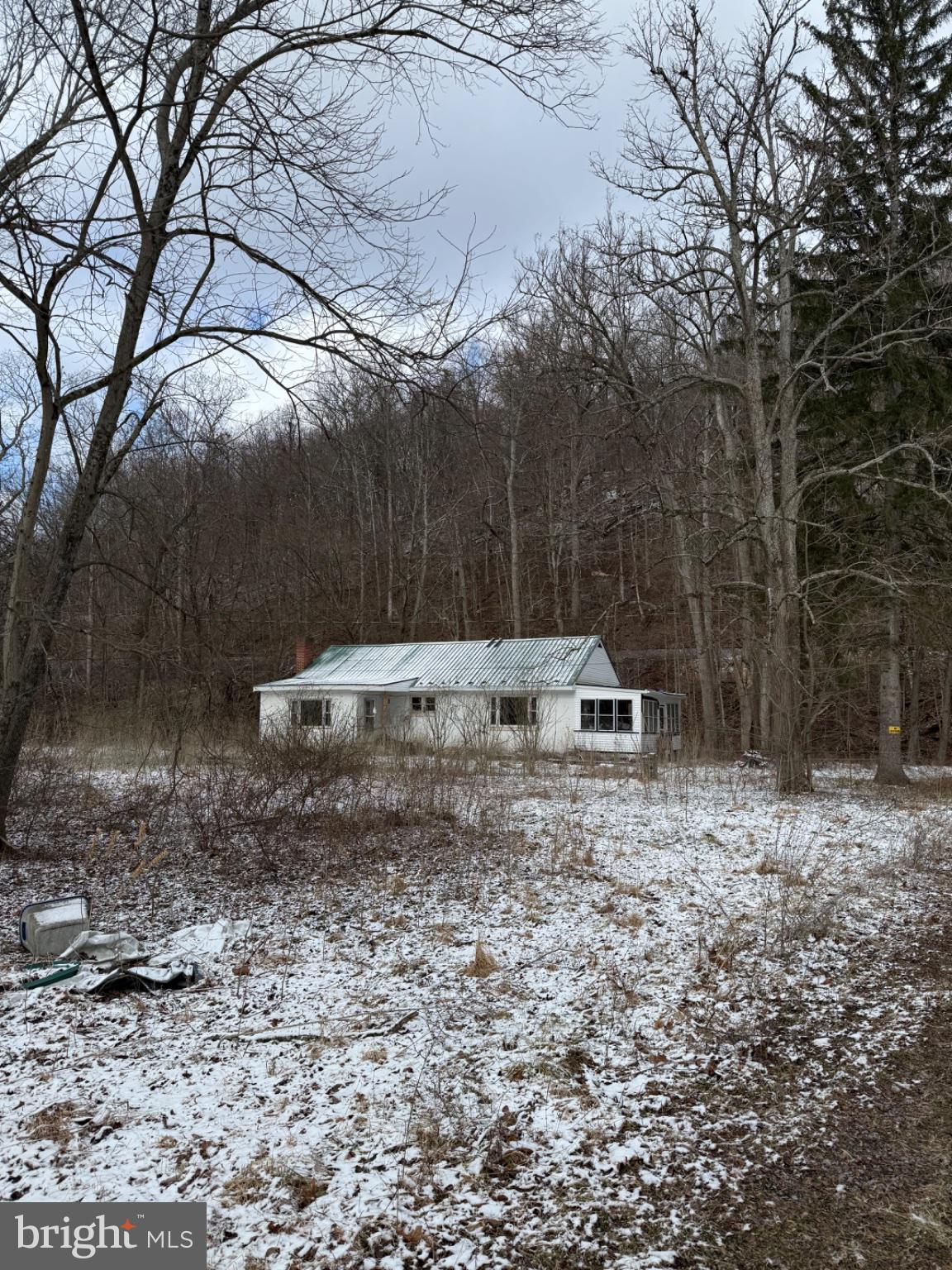 4685 Upper Road Shamokin, PA 17872 - Photo 4 of 12 a backyard of a house with barbeque oven table and chairs