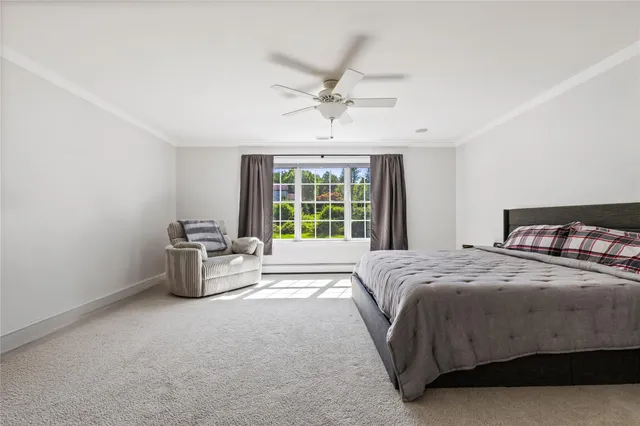 a spacious bedroom with a bed and a couch