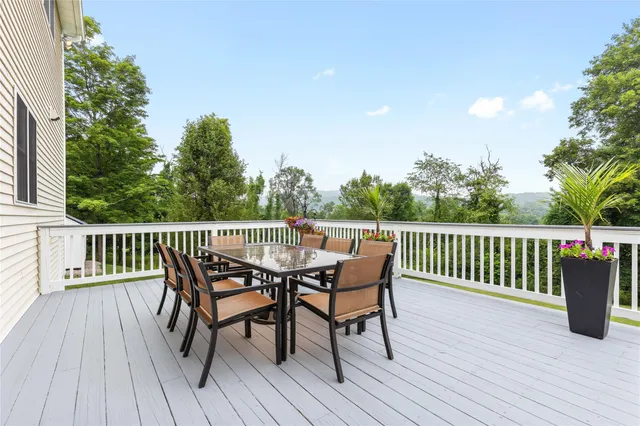 a living room with a bed furniture and a window