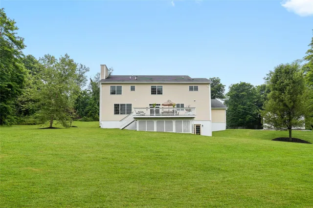 a view of a wooden deck with furniture