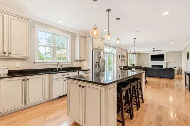 a kitchen with stainless steel appliances granite countertop a sink and cabinets