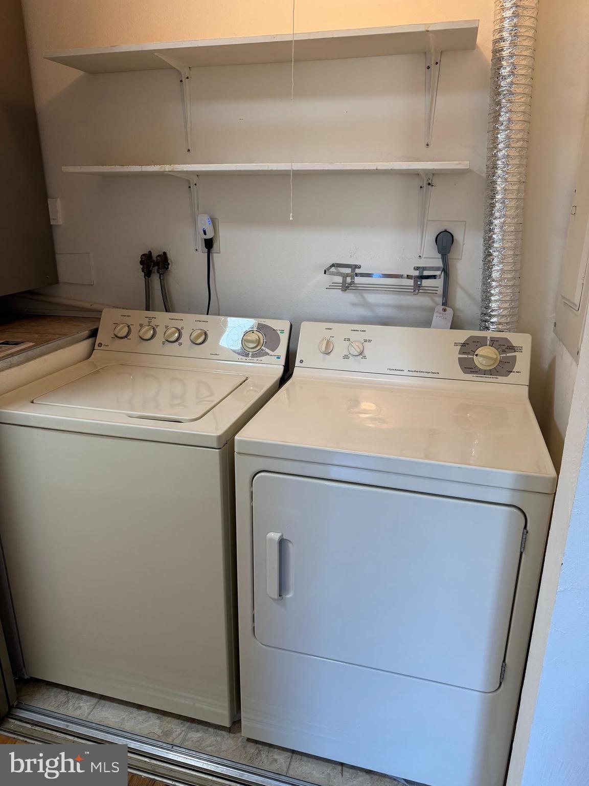 15418 Bramblewood Drive, Unit 20C Silver Spring, MD 20906 - Photo 12 of 18 a utility room with dryer and washer