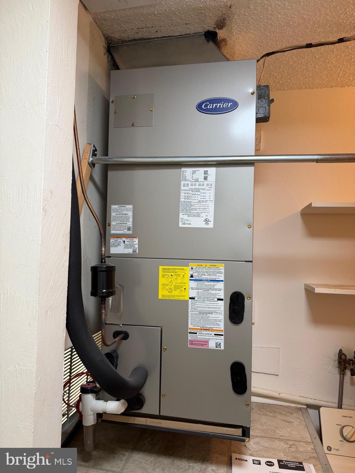 15418 Bramblewood Drive, Unit 20C Silver Spring, MD 20906 - Photo 13 of 18 a view of a bathroom with a sink and mirror