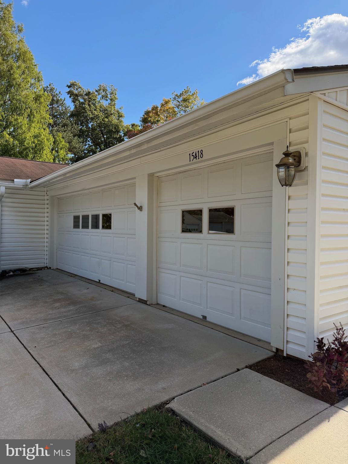 15418 Bramblewood Drive, Unit 20C Silver Spring, MD 20906 - Photo 15 of 18 a view of a house with a garage