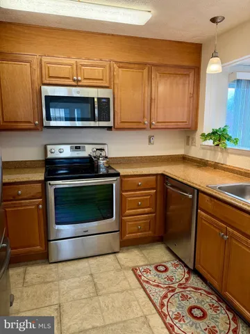 a kitchen with a stove and a microwave