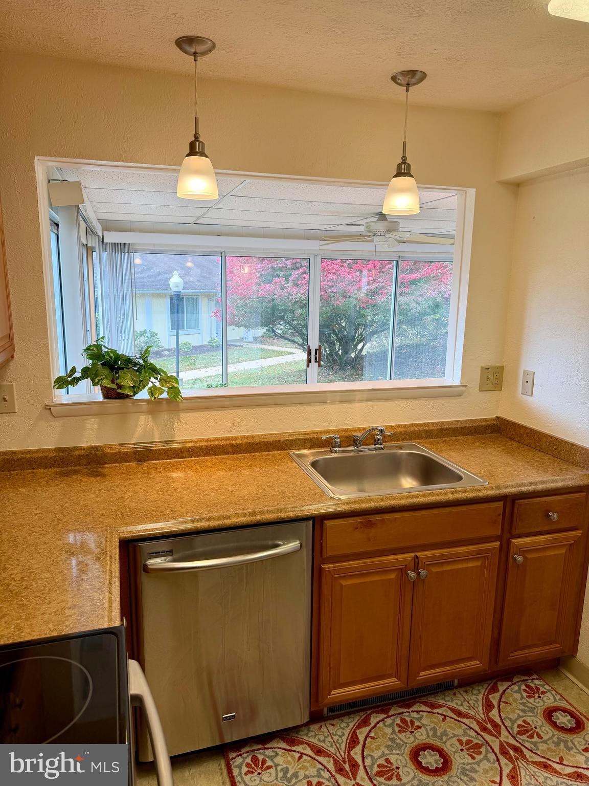 15418 Bramblewood Drive, Unit 20C Silver Spring, MD 20906 - Photo 6 of 18 a view of a kitchen with a sink and wooden floor